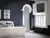 Bedroom with window dressed in white tier on tier shutters, closed with louvres open, dark blue walls, white bed with grey and dusky pink cushions, grey upholstered stool at bed, archway with white moulding.