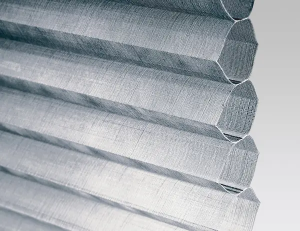 Close up of a steel grey duette blind showing the honeycomb shape at the side.