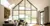 White blinds on rectangular and triangular shaped windows in a living room