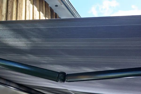 metal arms supporting the Tebbutts awning 